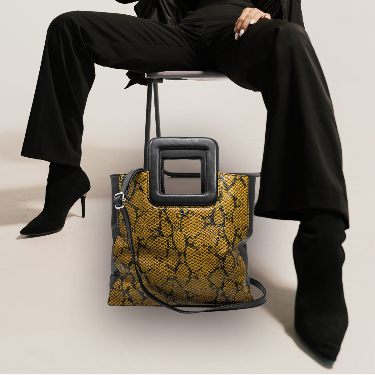 large black brown print leather print handbag with a square handle. Accessory for women in San Diego, CA.