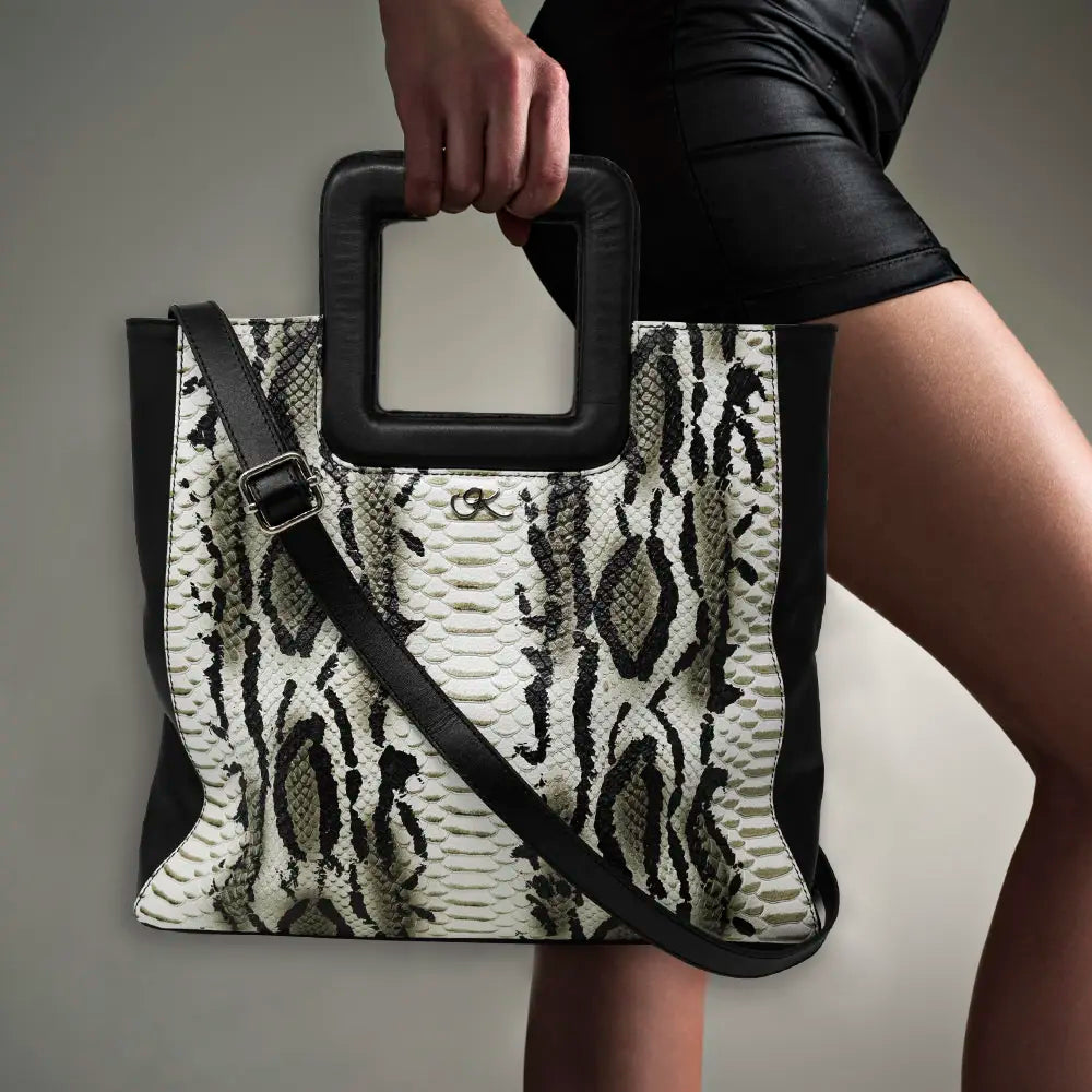 large black white print leather print handbag with a square handle. Accessory for women in San Diego, CA.