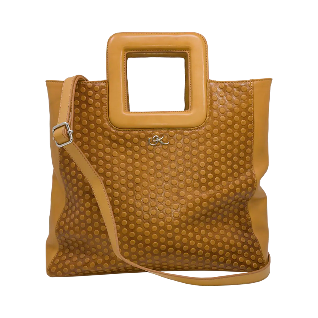 large tan circle leather print handbag with a square handle. Accessory for women in San Diego, CA.